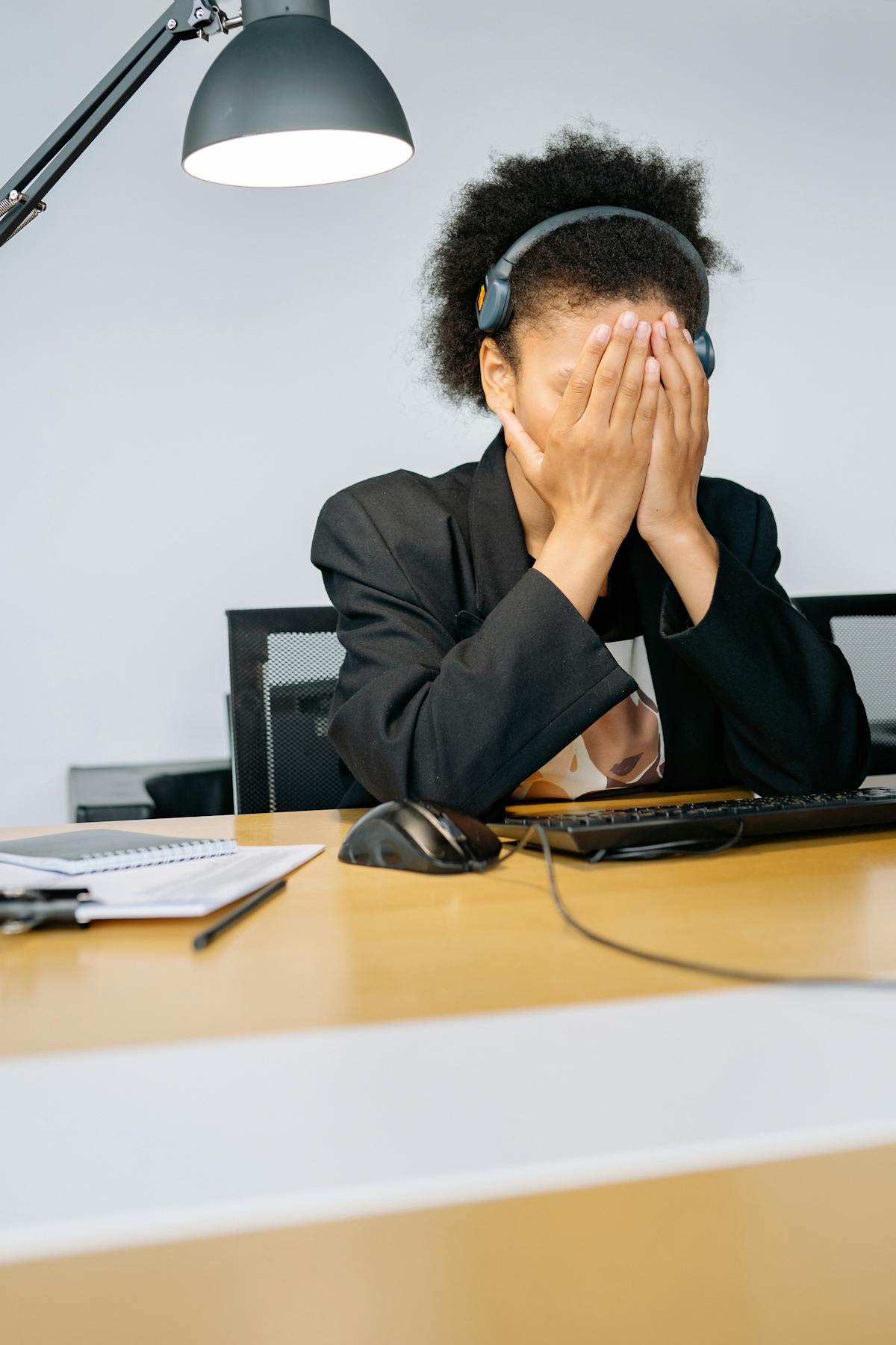 Overwhelmed receptionist at a busy front desk